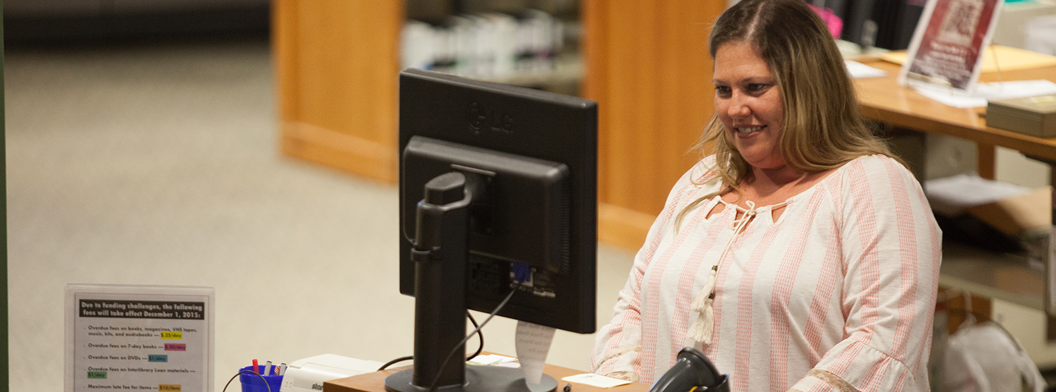 Woman at the circulation desk