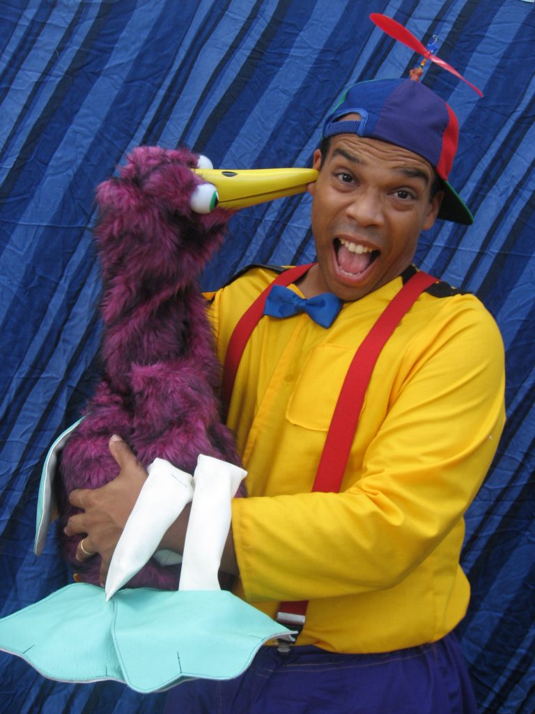 picture of Tommy Terrific holding his bird puppet