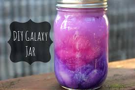 Photo of mason jar filled with paint and cotton to resemble the galaxy.