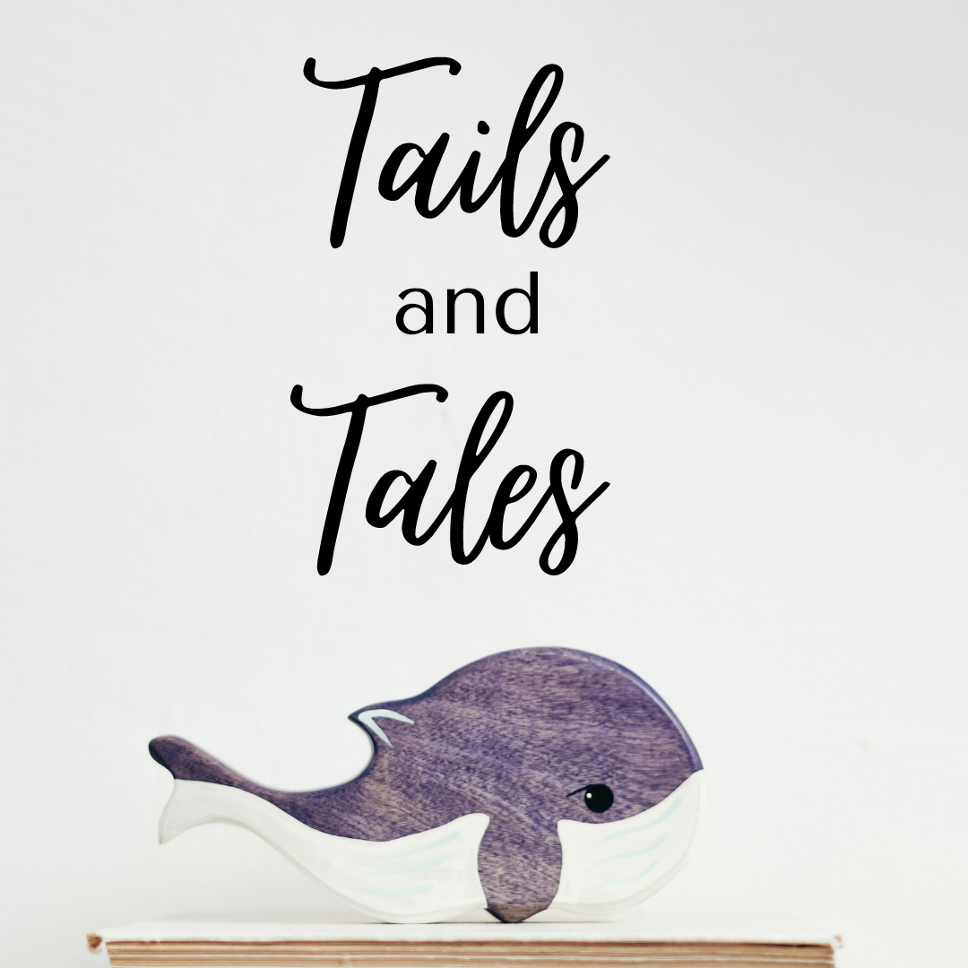 Tails and Tails in script font. Greyish whale underneath the heading. 