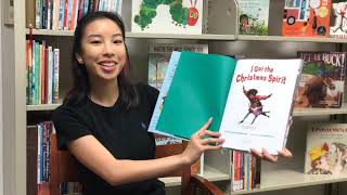 Christina holding a book