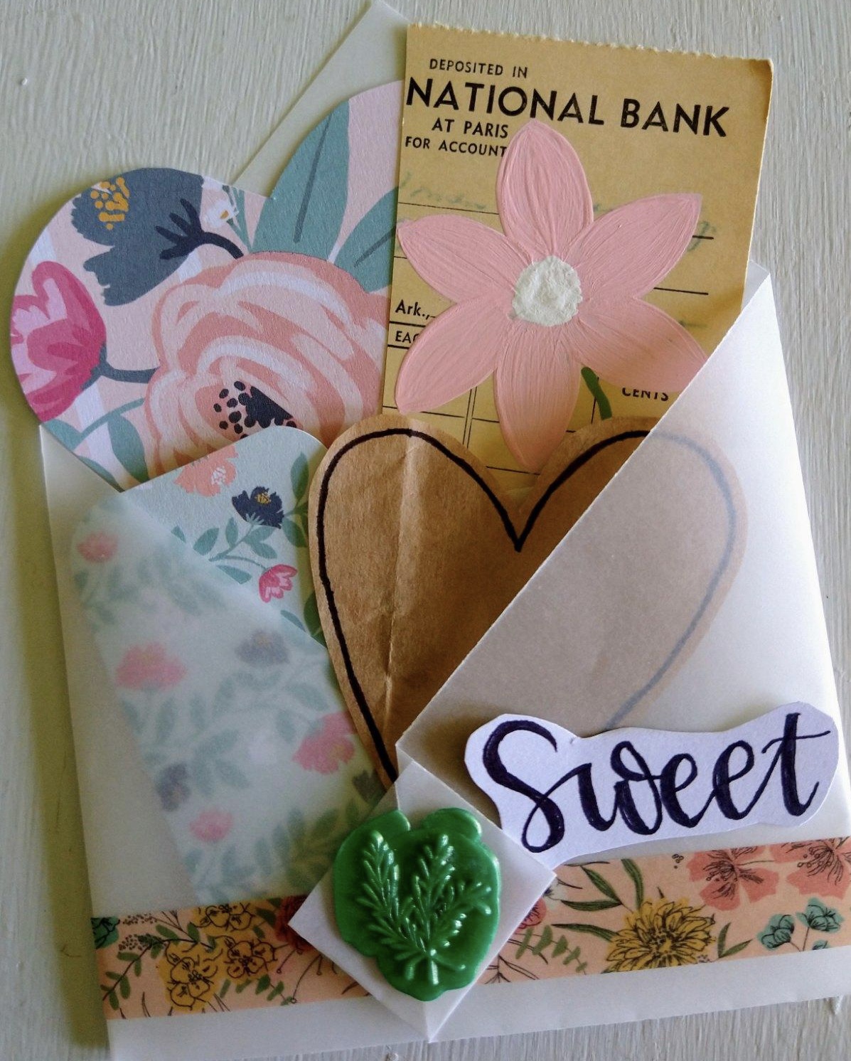 homemade envelope with scrapbook items in it