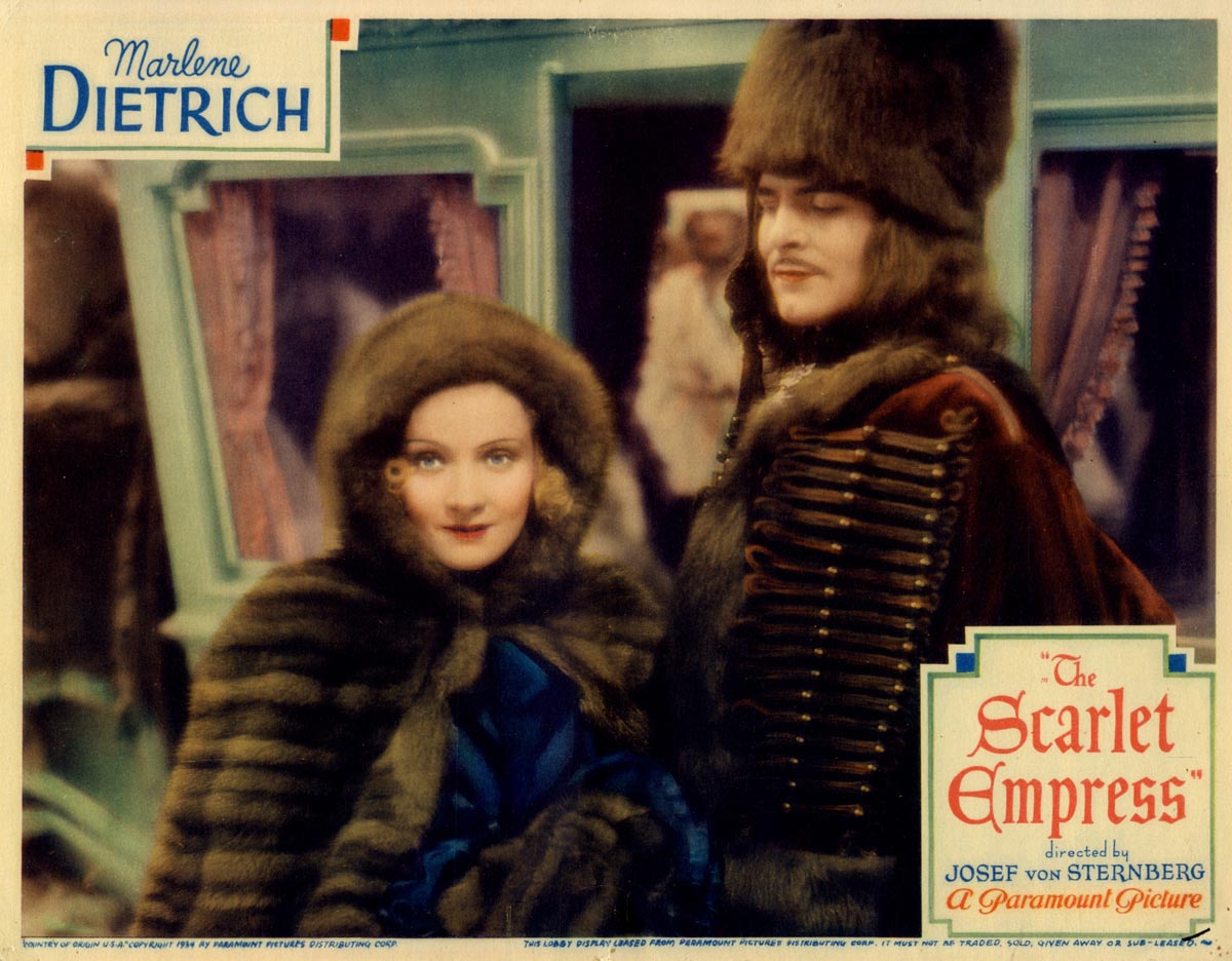 A colorized movie poster showing Marlene Dietrich and male next to each other. for the movie The Scarlet Empress. 