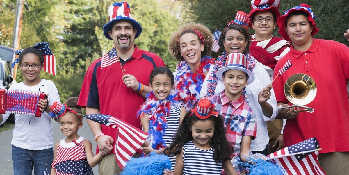 Family celebrating 4th of July all dressed in red, white, and blue