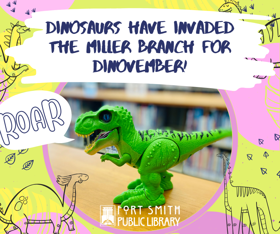 dinosaurs have invaded the Miller Branch - picture of green, toy t-rex in the library