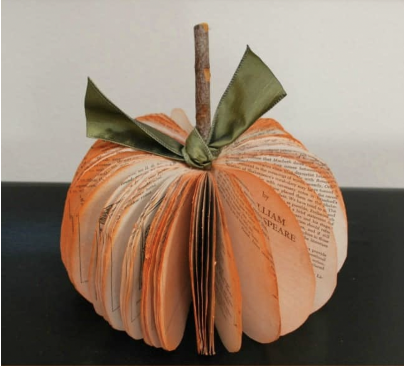 Book Page Pumpkin with orange spray coat on the outside. 