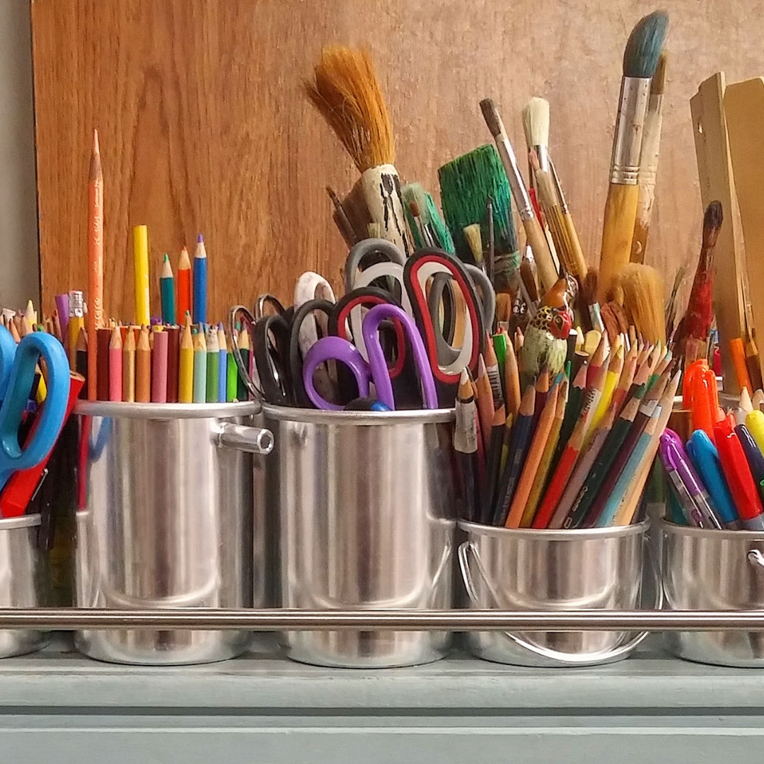 metal buckets filled with crafting supplies