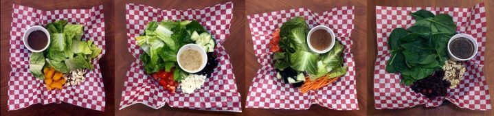four salads in cafe baskets