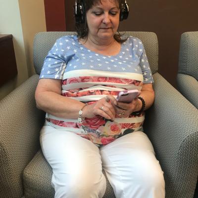 Customer listening to an audiobook on her phone