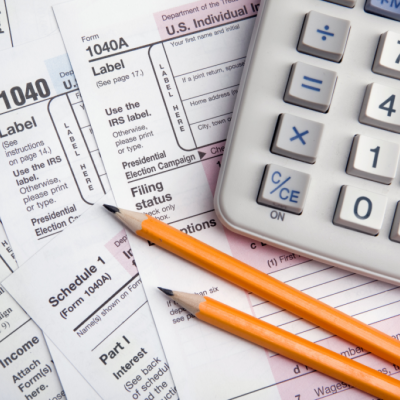 tax form, calculator, pencils
