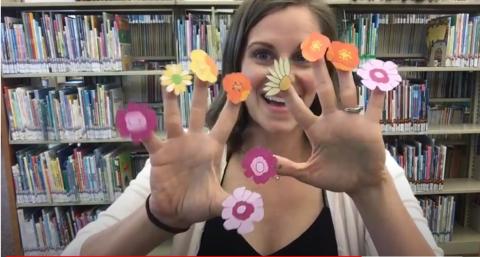 Mrs. Tiffany with flower puppets on her fingers