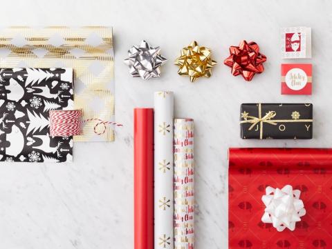 Gift Wrapping supplies on table. 