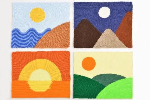 Four pieces of yarn art in a four square pattern. 