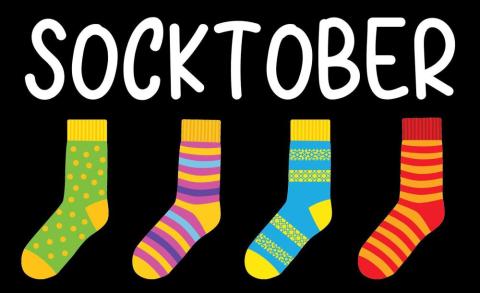 4 colorful socks with the word Socktober printed above