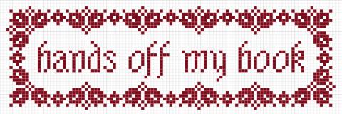 Cross stitched book mark that says "hands off my book"