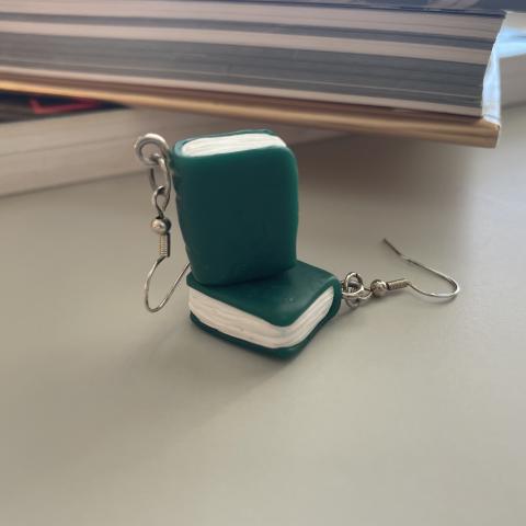 Pair of green book charm earrings