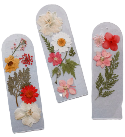 3 bookmarks with pressed flowers on them