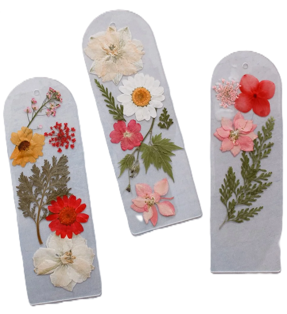 3 bookmarks with pressed flowers on them