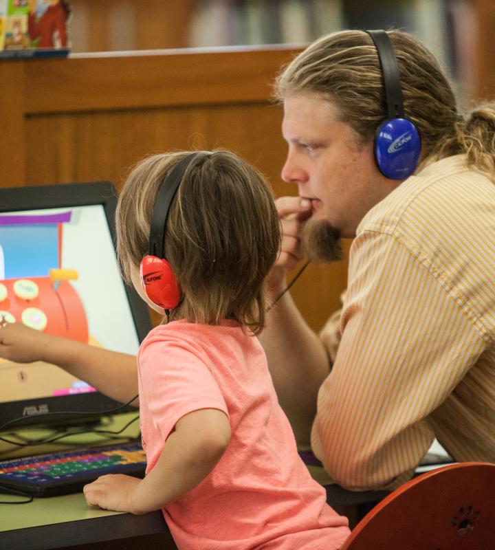 Young girl using a library computer