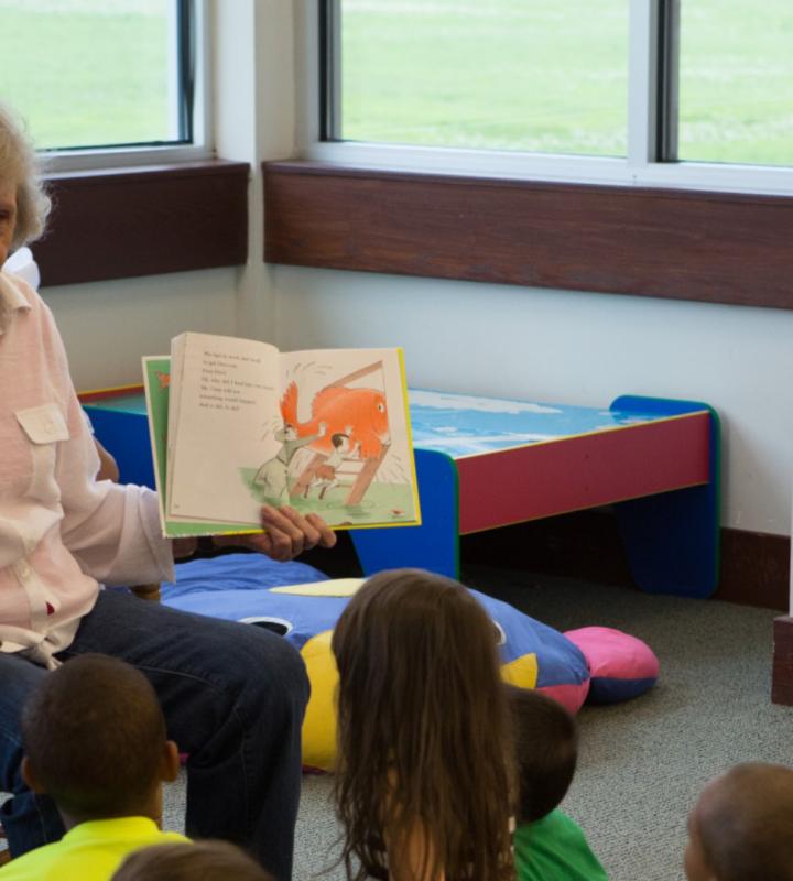 Woman reading to children during storytime at Windsor Drive Branch